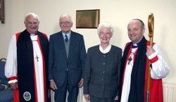 Dr Bob Common and his wife Cathie are pictured after the dedication of a wall plaque, which they presented to Dunmurry Parish Church, listing the clergy who have served in the parish over the past 100 years.  Included in the photo are Lord Eames (left) and the Rt Rev Alan Abernethy (Bishop of Connor).